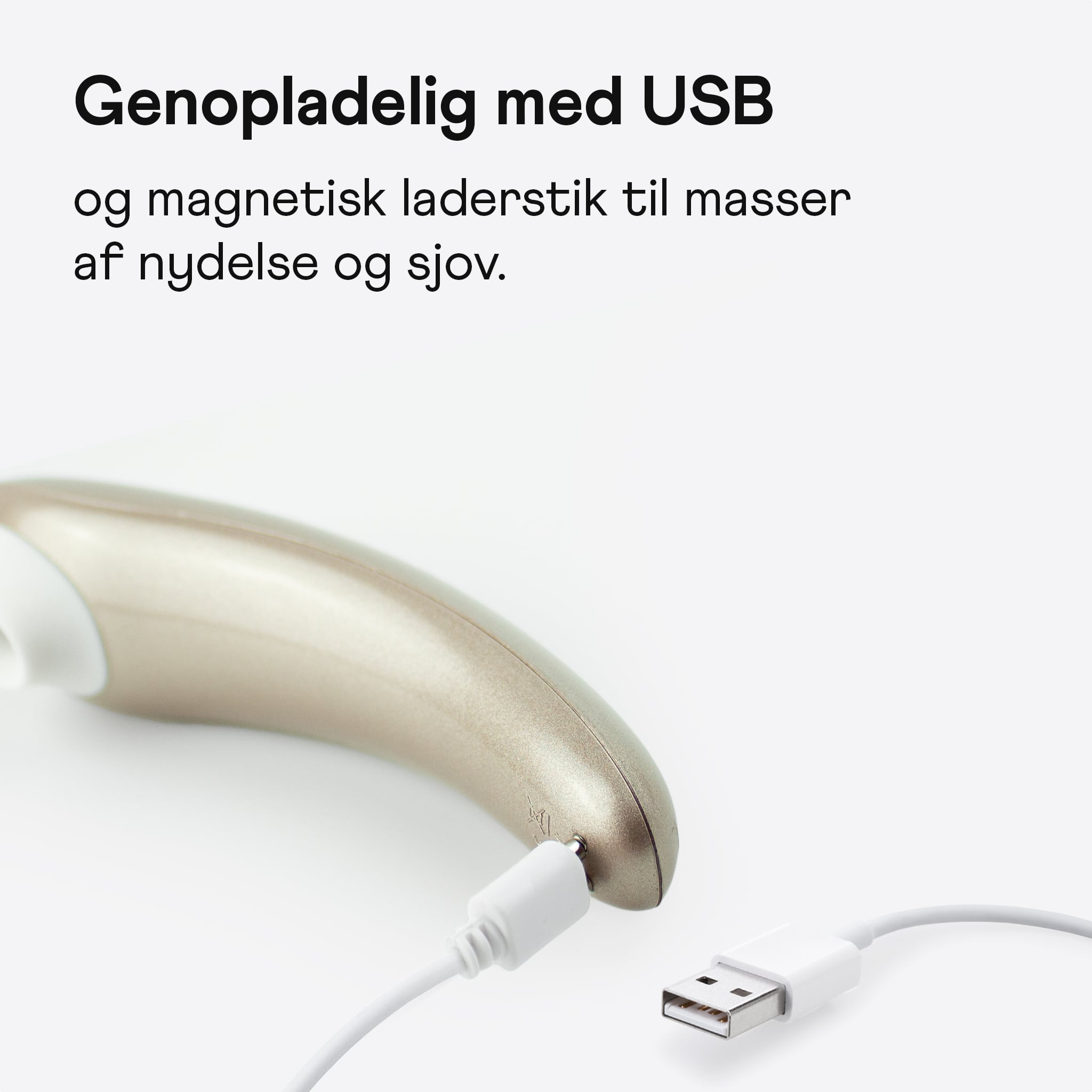 Nærbillede af Amina Wave Pro pulserende klitoris stimulator liggende med tilsluttet oplader